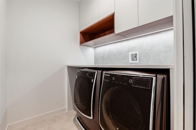 2807 Garwood St, Austin, TX 78702 - laundry room featuring washer and clothes dryer, baseboards, and light tile patterned floors