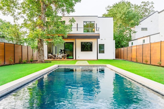 2807 Garwood St, Austin, TX 78702 - rear view of property featuring a balcony, stucco siding, an outdoor living space, and a patio area