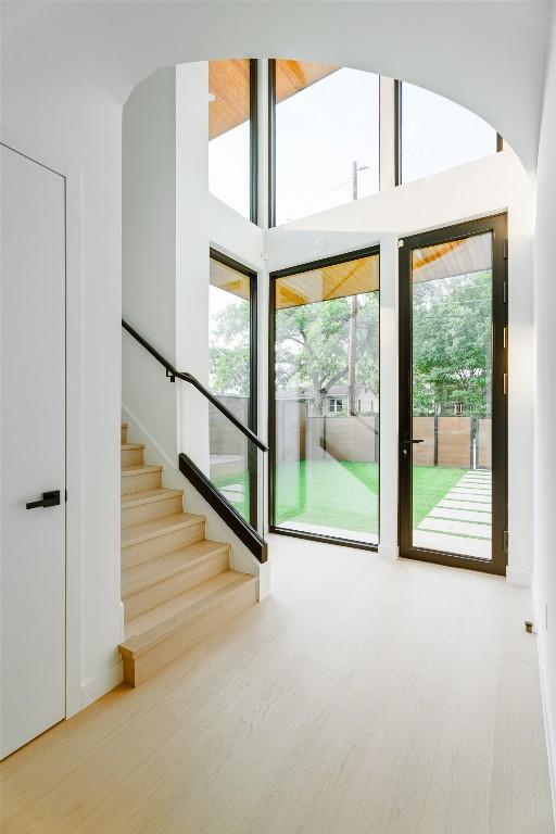 2807 Garwood St, Austin, TX 78702 - doorway featuring wood finished floors and stairs