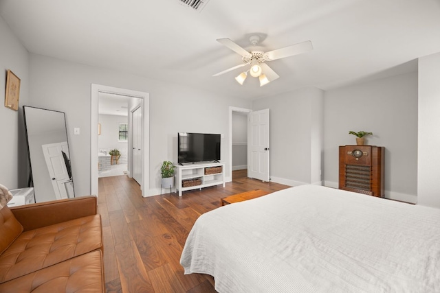 10805 Flashpoint Ct, Austin, TX 78736 - bedroom with wood finished floors, baseboards, and a ceiling fan