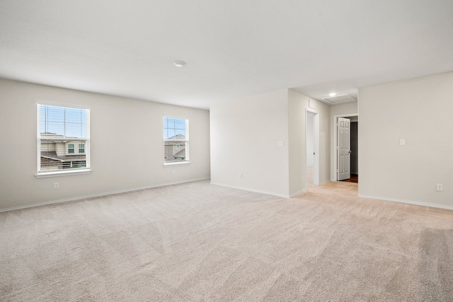 128 Rock Nettle, New Braunfels, TX 78130 - empty room with light carpet, baseboards, and attic access