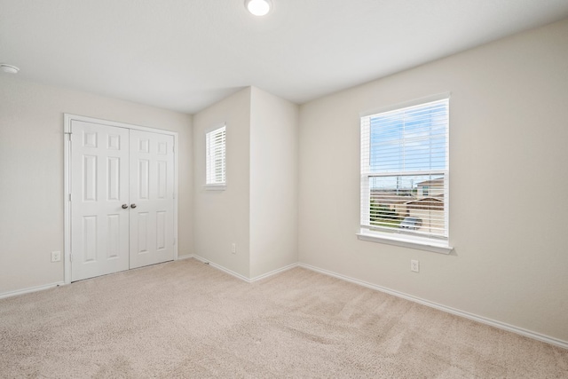 128 Rock Nettle, New Braunfels, TX 78130 - unfurnished bedroom with carpet floors, baseboards, and a closet