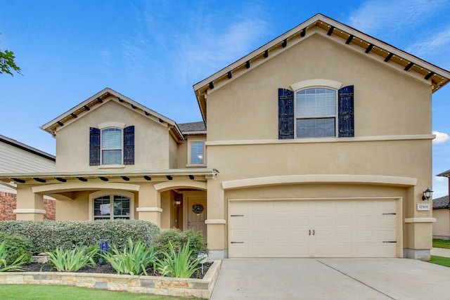 17101 Borromeo Ave, Pflugerville, TX 78660 - mediterranean / spanish home with an attached garage, stucco siding, and concrete driveway