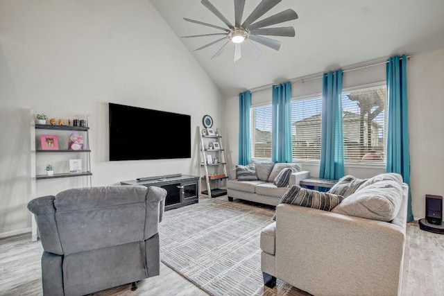17101 Borromeo Ave, Pflugerville, TX 78660 - living room with ceiling fan, wood finished floors, and high vaulted ceiling