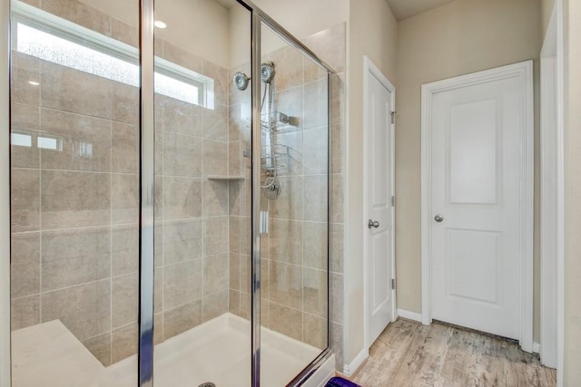 17101 Borromeo Ave, Pflugerville, TX 78660 - full bath featuring a shower stall, wood finished floors, and baseboards