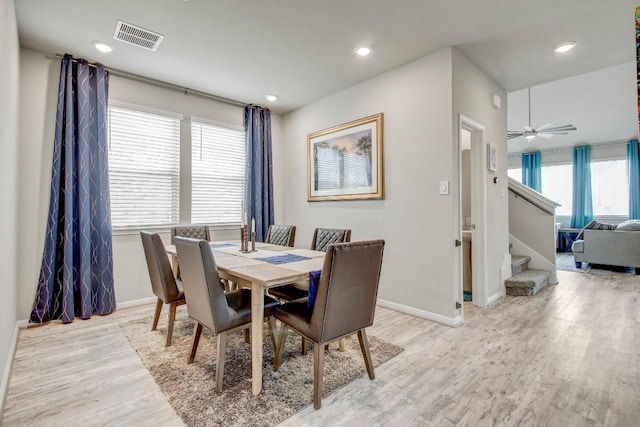 17101 Borromeo Ave, Pflugerville, TX 78660 - dining room with light wood-type flooring, stairway, baseboards, recessed lighting, and a ceiling fan