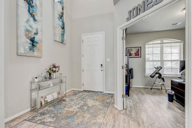 17101 Borromeo Ave, Pflugerville, TX 78660 - foyer featuring wood finished floors and baseboards