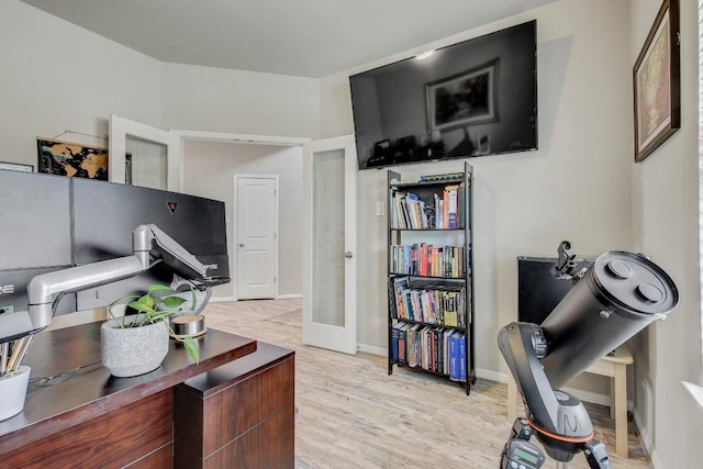 17101 Borromeo Ave, Pflugerville, TX 78660 - office area featuring light wood-type flooring, french doors, and baseboards