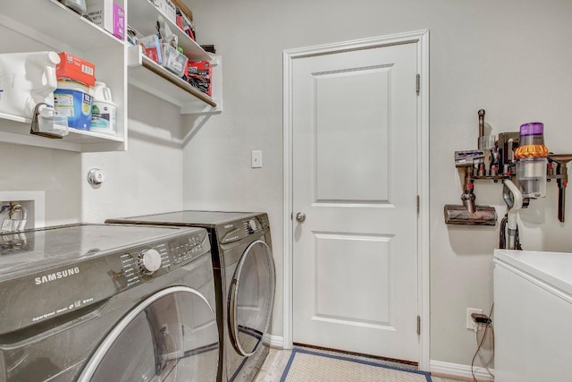 17101 Borromeo Ave, Pflugerville, TX 78660 - washroom with washing machine and dryer and baseboards