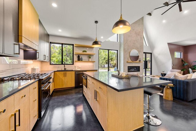 4506 Clawson Rd Unit 1, Austin, TX 78745 - kitchen featuring stainless steel gas range, light brown cabinetry, concrete flooring, open floor plan, and decorative backsplash