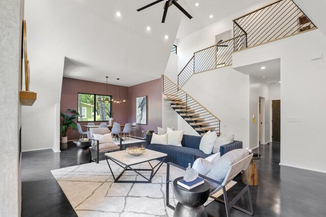 4506 Clawson Rd Unit 1, Austin, TX 78745 - living area with stairs, a towering ceiling, a ceiling fan, a chandelier, and recessed lighting