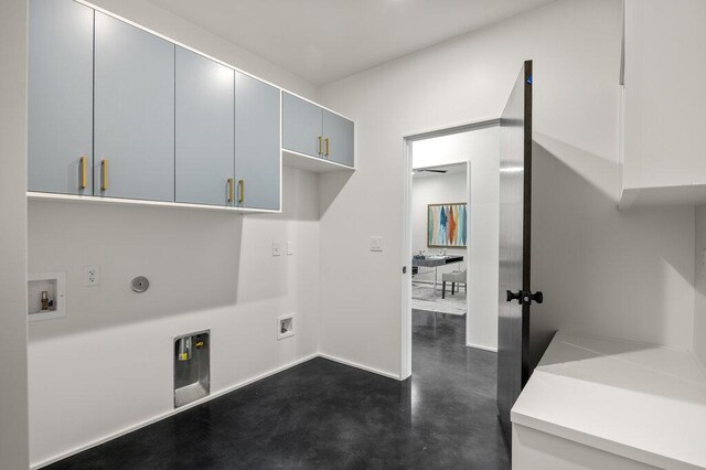 4506 Clawson Rd Unit 1, Austin, TX 78745 - laundry room with cabinet space, washer hookup, hookup for a gas dryer, electric dryer hookup, and baseboards