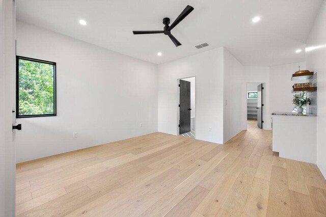 4506 Clawson Rd Unit 1, Austin, TX 78745 - empty room with light wood-style flooring, plenty of natural light, a ceiling fan, and recessed lighting