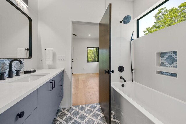 4506 Clawson Rd Unit 1, Austin, TX 78745 - bathroom with vanity, wood finished floors, recessed lighting, and decorative backsplash