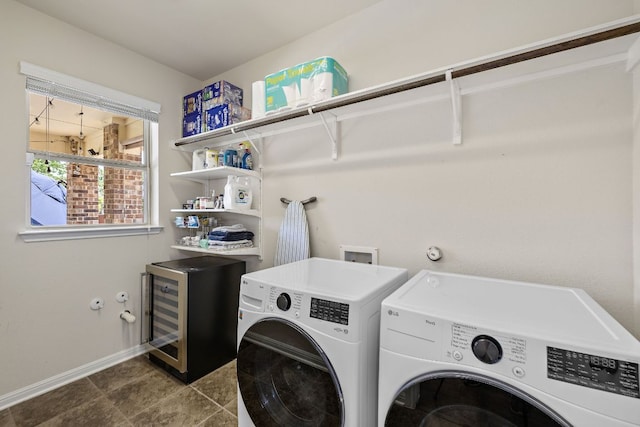2313 Legend Hill Dr, Leander, TX 78641 - laundry area with washer and clothes dryer and beverage cooler