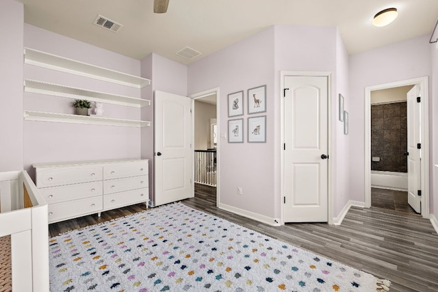 2313 Legend Hill Dr, Leander, TX 78641 - bedroom with wood finished floors and ensuite bath