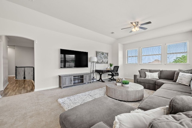 2313 Legend Hill Dr, Leander, TX 78641 - living area with a ceiling fan, carpet flooring, and arched walkways