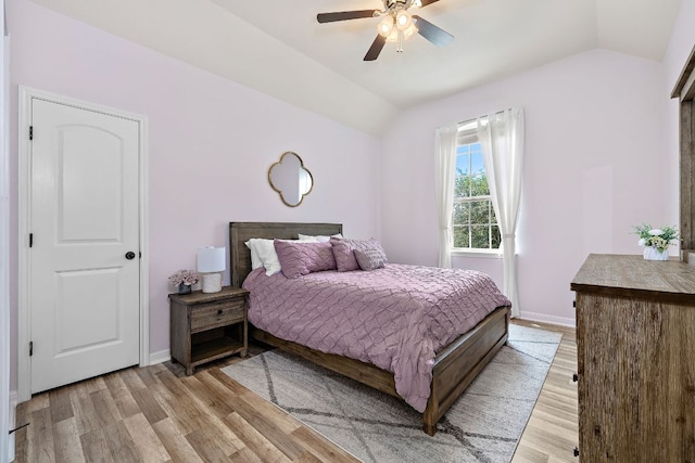 2313 Legend Hill Dr, Leander, TX 78641 - bedroom featuring vaulted ceiling, light wood-style floors, and a ceiling fan