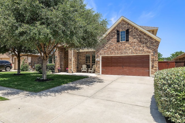 2313 Legend Hill Dr, Leander, TX 78641 - view of front of property with concrete driveway, brick siding, and a front lawn