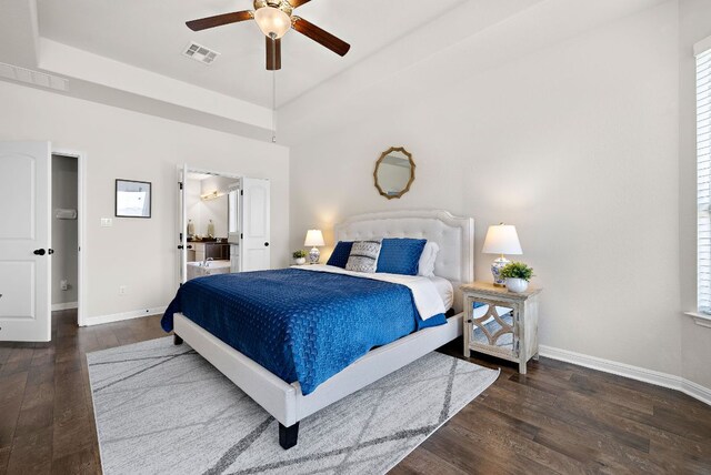 2313 Legend Hill Dr, Leander, TX 78641 - bedroom featuring wood finished floors, ceiling fan, and a tray ceiling