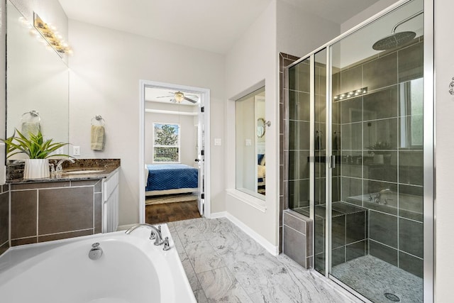 2313 Legend Hill Dr, Leander, TX 78641 - bathroom with a stall shower, vanity, ensuite bathroom, marble finish floors, and a garden tub