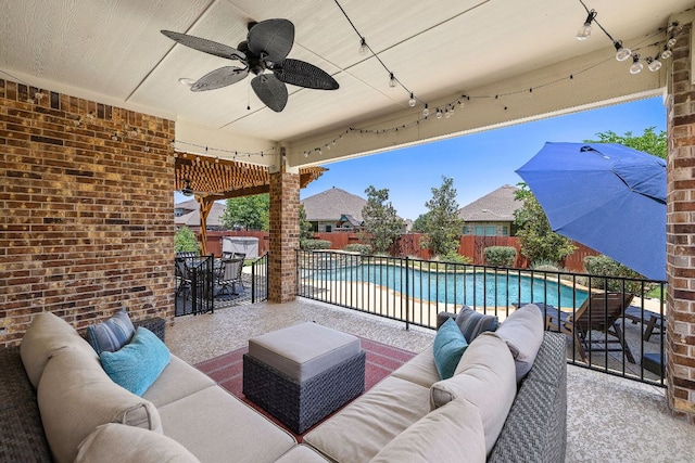 2313 Legend Hill Dr, Leander, TX 78641 - fenced backyard featuring an outdoor living space, a patio area, ceiling fan, and outdoor dining space