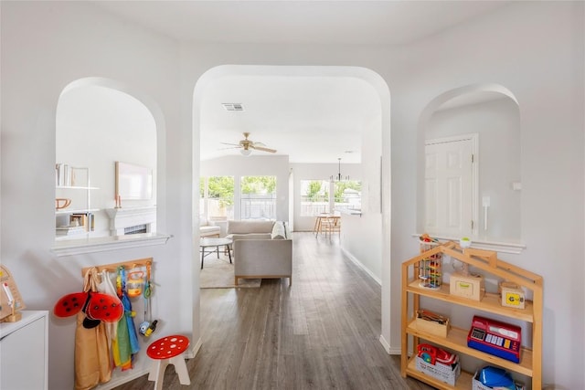 8908 Campo Verde Ct, Austin, TX 78749 - hallway with arched walkways, wood finished floors, and baseboards