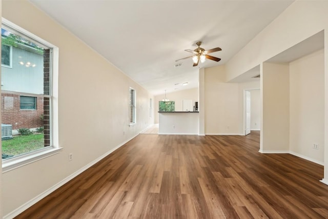 11201 Canterbury Tales Ln, Austin, TX 78748 - unfurnished living room with vaulted ceiling, wood finished floors, a ceiling fan, and baseboards