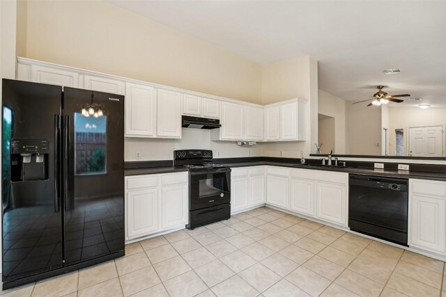 11201 Canterbury Tales Ln, Austin, TX 78748 - kitchen with black appliances, under cabinet range hood, a sink, dark countertops, and light tile patterned floors
