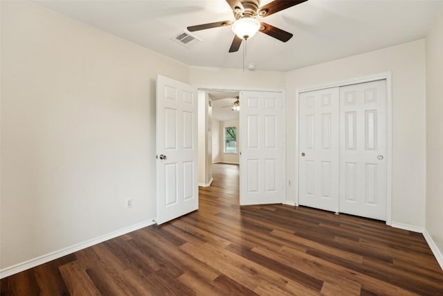 11201 Canterbury Tales Ln, Austin, TX 78748 - unfurnished bedroom featuring dark wood-type flooring, baseboards, a closet, and ceiling fan