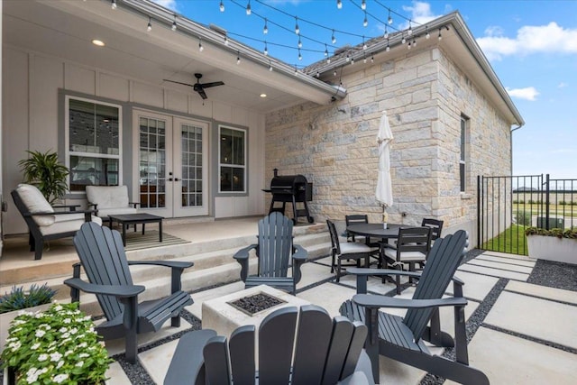 8904 Apogee Blvd, Austin, TX 78744 - view of patio featuring french doors, a fire pit, a grill, and a ceiling fan