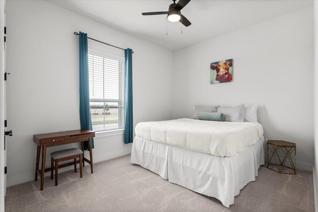 8904 Apogee Blvd, Austin, TX 78744 - bedroom with carpet, baseboards, and ceiling fan