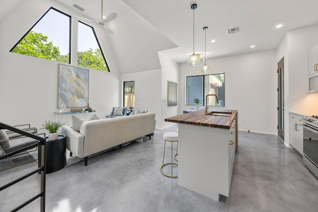 4506 Clawson Rd Unit 2, Austin, TX 78745 - living area with concrete floors, recessed lighting, and high vaulted ceiling