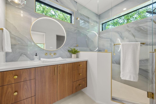 4506 Clawson Rd Unit 2, Austin, TX 78745 - bathroom with a marble finish shower, vanity, and tile patterned floors