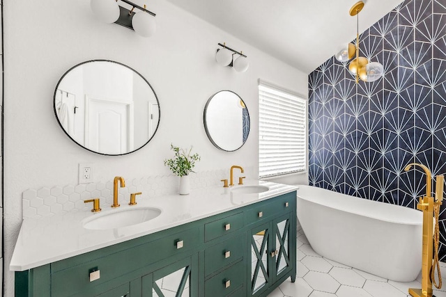 3712 Sawmill Dr, Austin, TX 78749 - full bath featuring wallpapered walls, an accent wall, double vanity, a freestanding bath, and tile patterned flooring