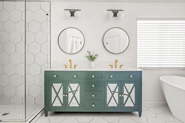 3712 Sawmill Dr, Austin, TX 78749 - bathroom featuring healthy amount of natural light, double vanity, a tile shower, and a freestanding tub