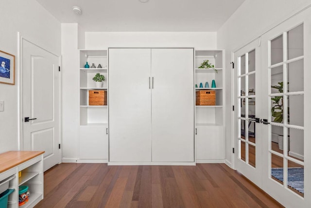 3712 Sawmill Dr, Austin, TX 78749 - unfurnished bedroom featuring french doors, dark wood-style floors, and a closet