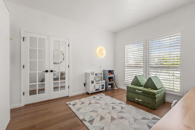 3712 Sawmill Dr, Austin, TX 78749 - living area featuring wood finished floors, baseboards, and french doors