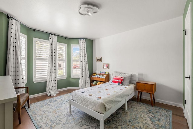 3712 Sawmill Dr, Austin, TX 78749 - bedroom with baseboards and wood finished floors