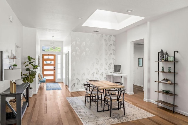 3712 Sawmill Dr, Austin, TX 78749 - dining space featuring light wood finished floors, baseboards, and a skylight