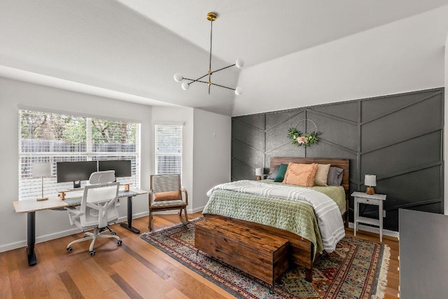 3712 Sawmill Dr, Austin, TX 78749 - bedroom with a desk, wood finished floors, a chandelier, baseboards, and lofted ceiling
