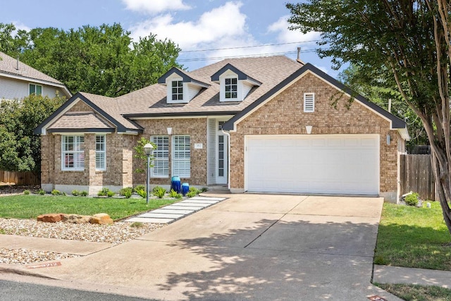 3712 Sawmill Dr, Austin, TX 78749 - view of front of property with driveway, an attached garage, brick siding, and roof with shingles