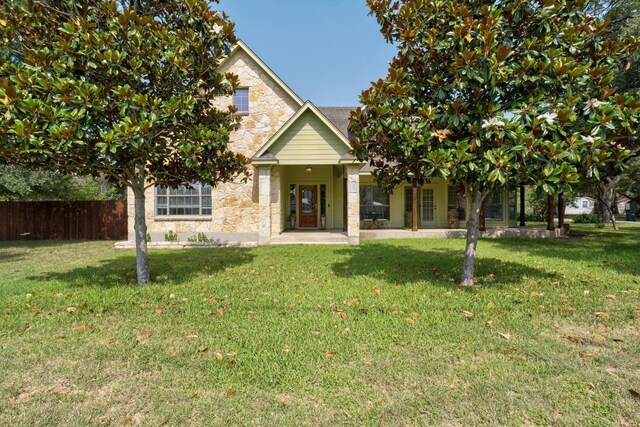 400 S Sledge St, Kyle, TX 78640 - obstructed view of property featuring stone siding
