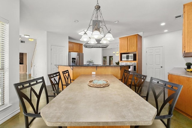 400 S Sledge St, Kyle, TX 78640 - dining room with baseboards, a chandelier, and recessed lighting
