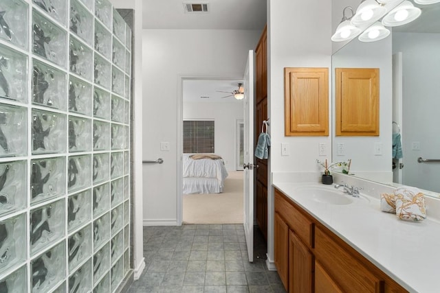 400 S Sledge St, Kyle, TX 78640 - ensuite bathroom featuring vanity, walk in shower, a ceiling fan, and a chandelier