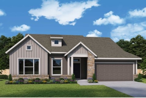 256 Pine Bark Dr, Buda, TX 78610 - view of front facade with board and batten siding, an attached garage, concrete driveway, and a front lawn