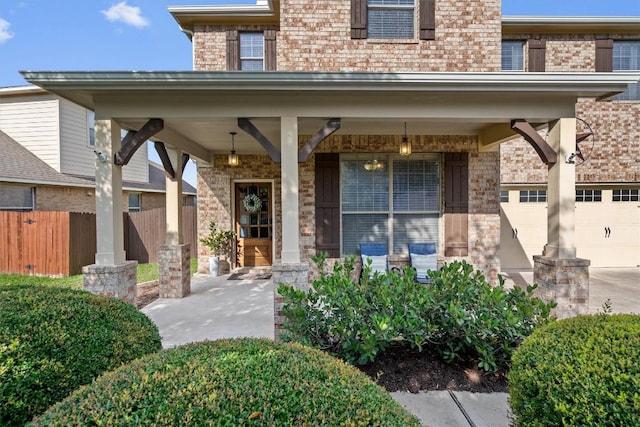 3517 Shellcastle Ln, Round Rock, TX 78681 - entrance to property featuring brick siding, covered porch, and a garage