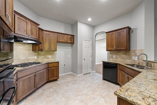 5501 Wild Foxglove Rd, Spicewood, TX 78669 - kitchen featuring dishwasher, a sink, under cabinet range hood, light stone countertops, and recessed lighting