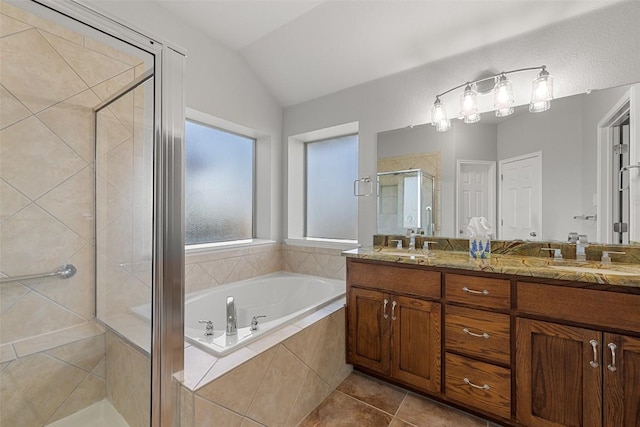 5501 Wild Foxglove Rd, Spicewood, TX 78669 - bathroom featuring a shower stall, a garden tub, double vanity, lofted ceiling, and tile patterned flooring