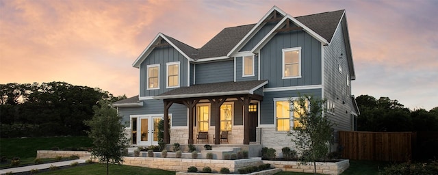 225 Hazy Hills Loop, Dripping Springs, TX 78620 - craftsman inspired home featuring board and batten siding, french doors, covered porch, and stone siding